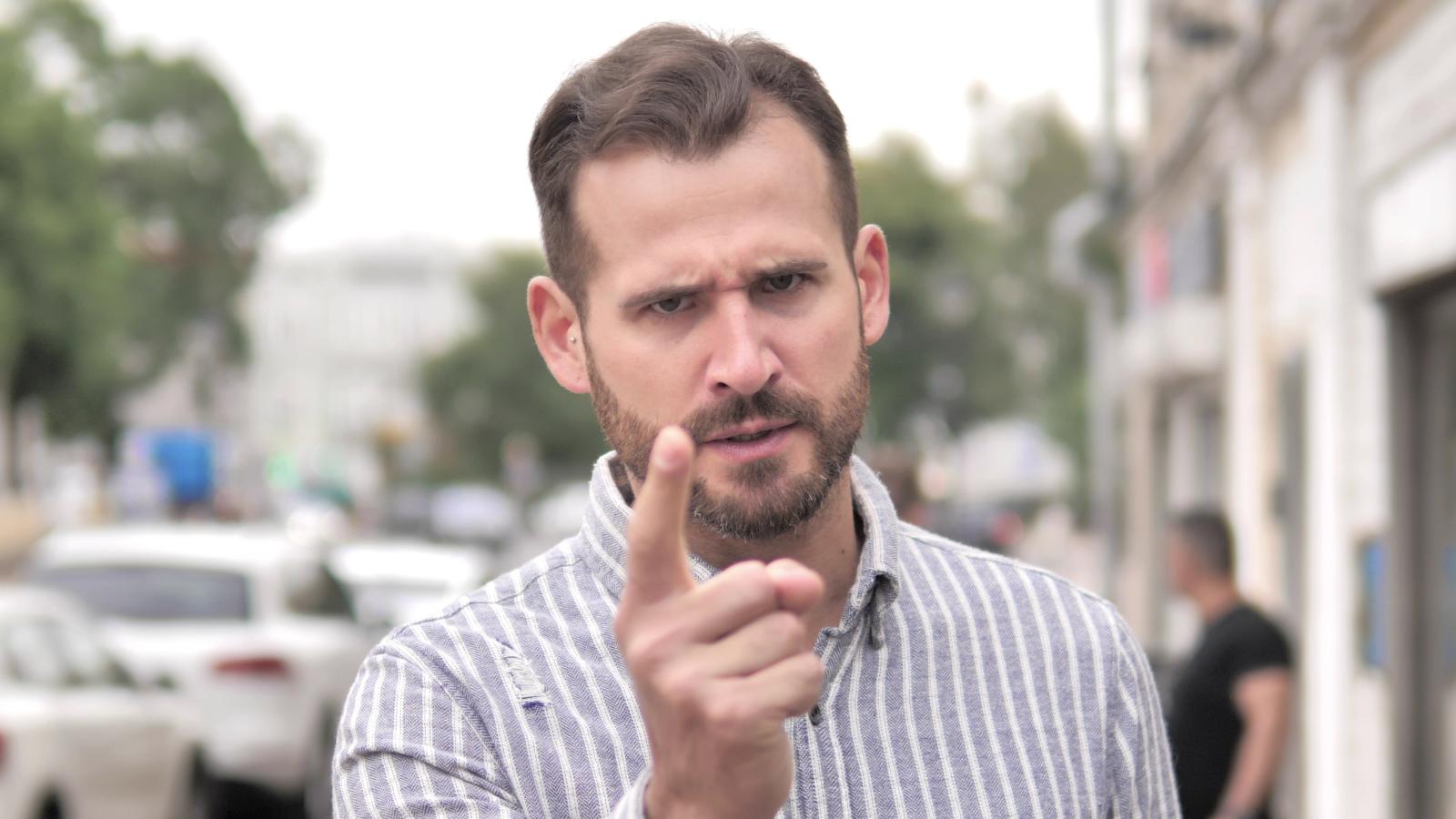 man pointing his finger