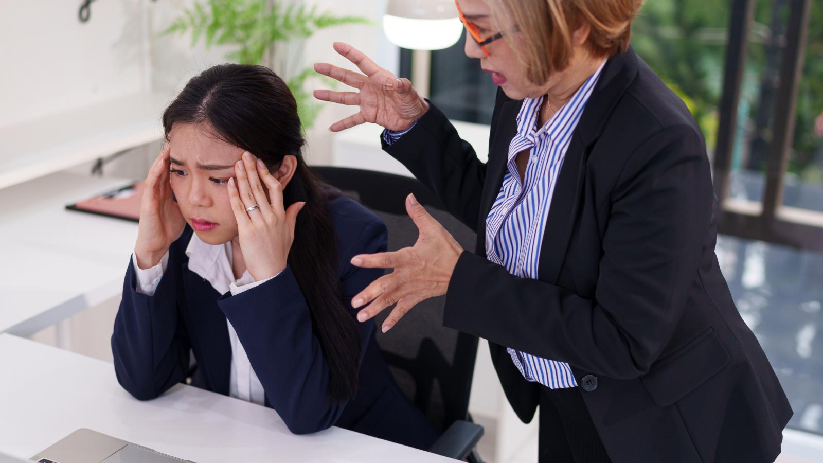 boss yelling at a worker