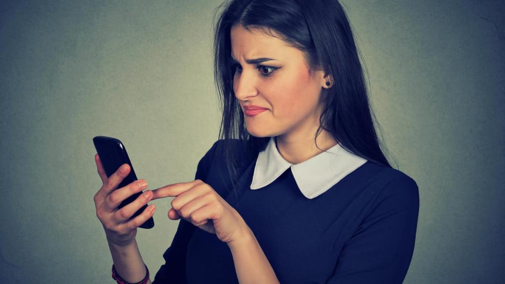 woman looking at her phone