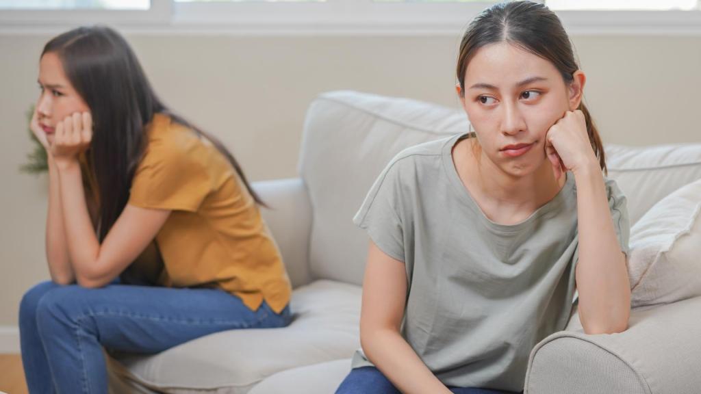 two women on a couch