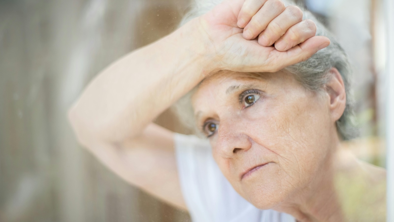 old elderly woman looking distraught 