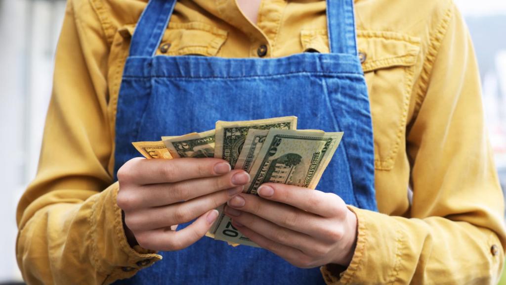 a woman holding money