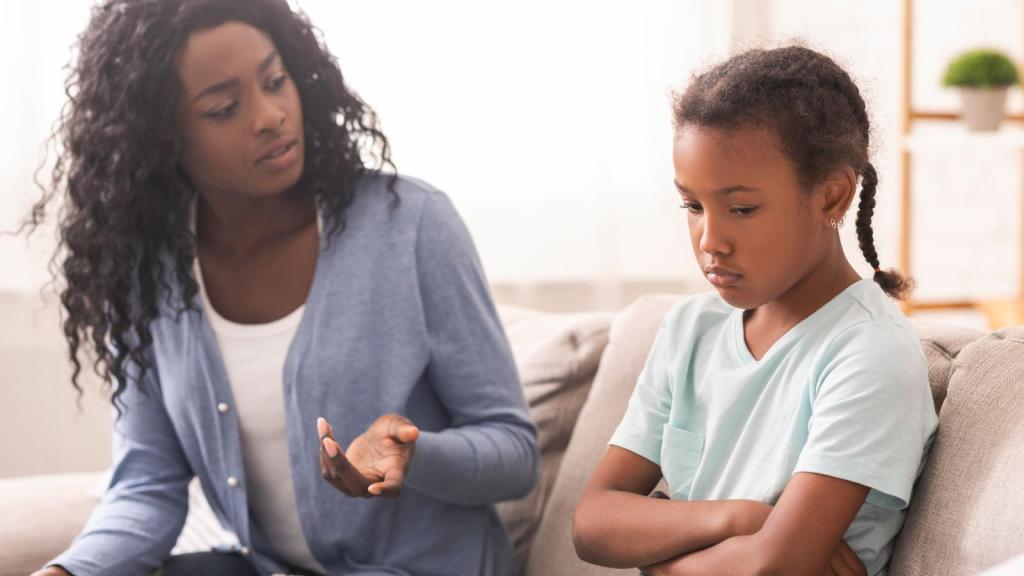 woman talking to a young child
