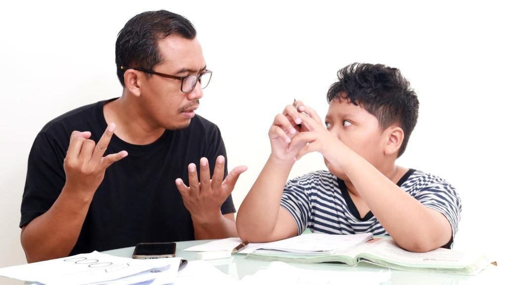 man talking to a boy