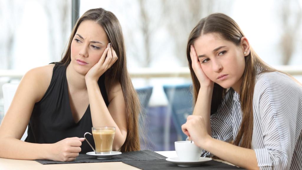 two women ignoring each other
