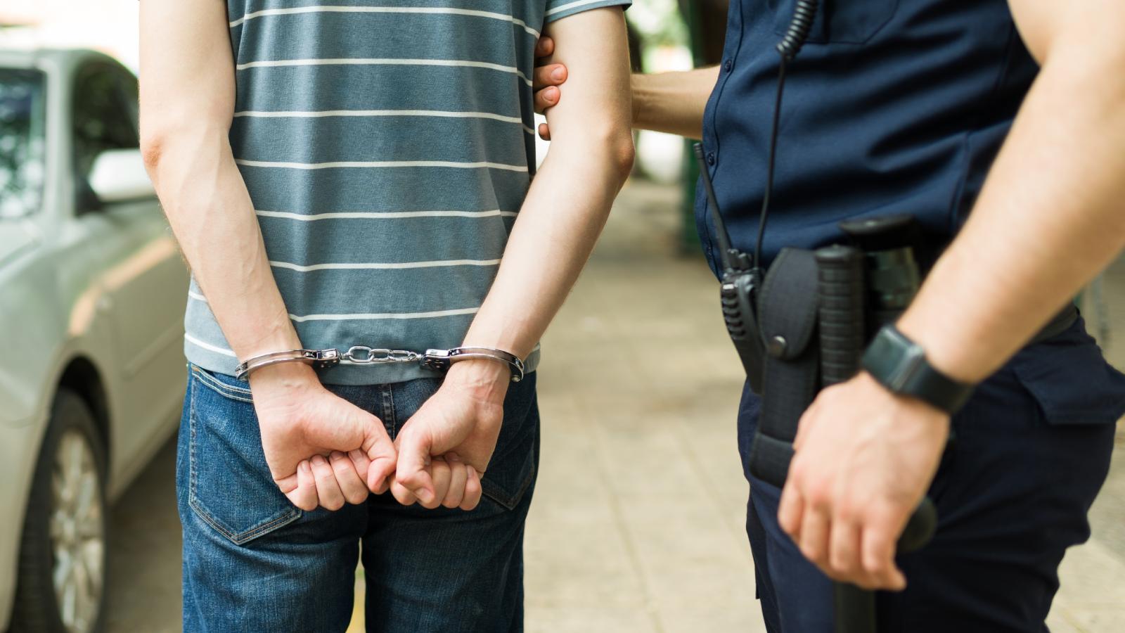 cop arresting a man