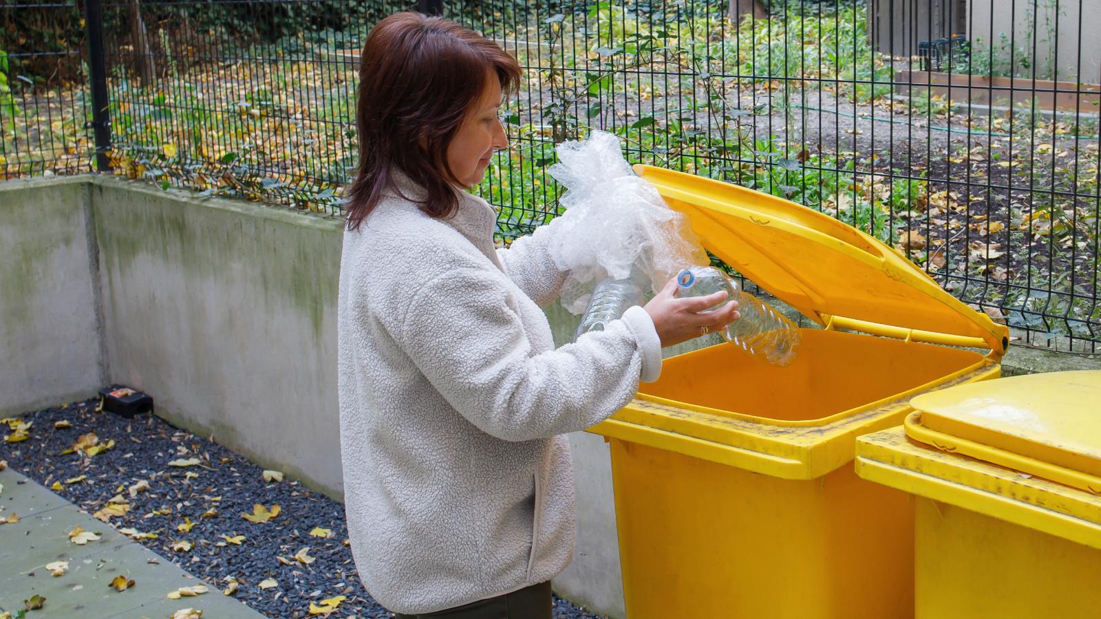 woman throwing out trash