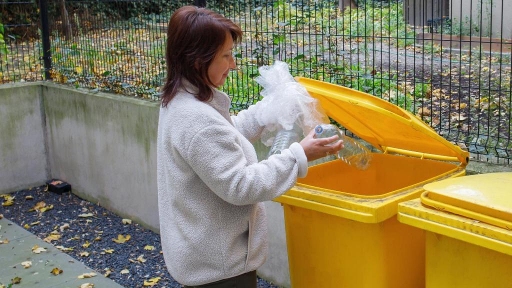 woman throwing out trash