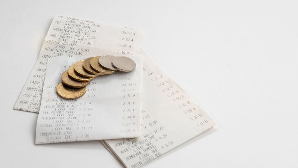 coins laying on a receipt