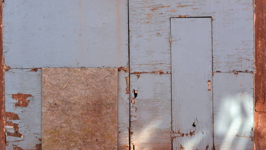 plywood leaning against wall
