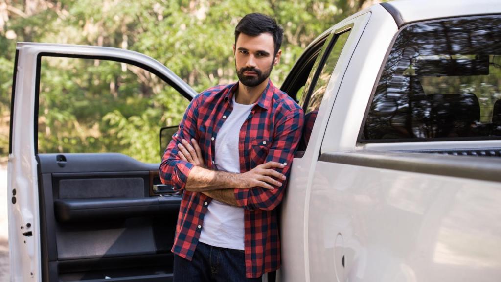 man standing by a truck