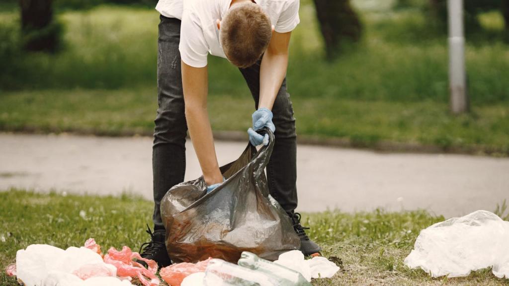 man picking up some trash