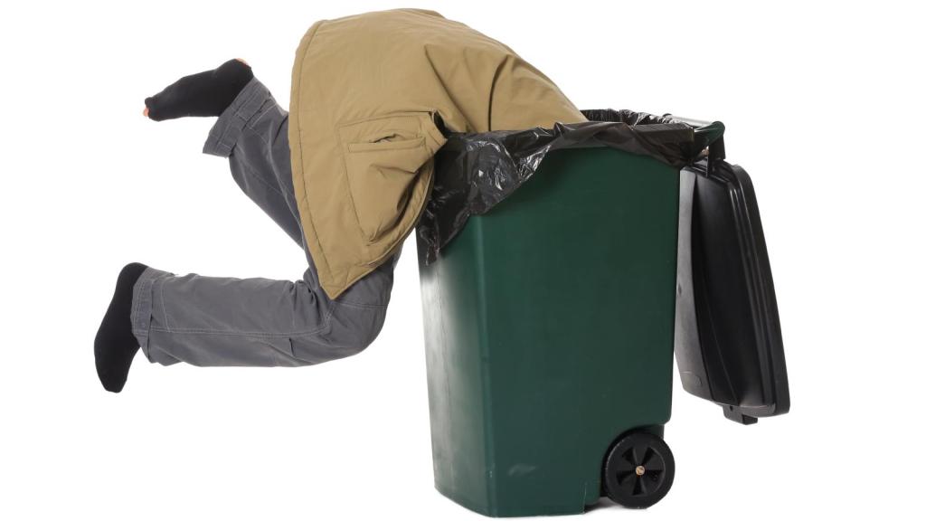 man in a trash can
