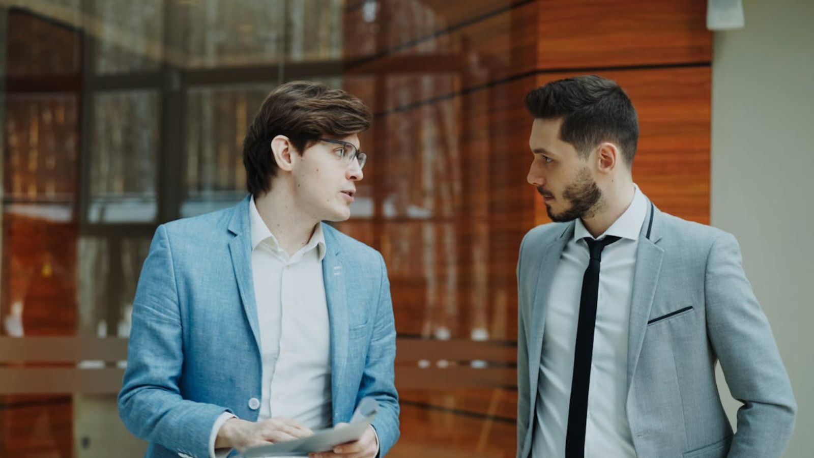 two men talking seriosuly with each other
