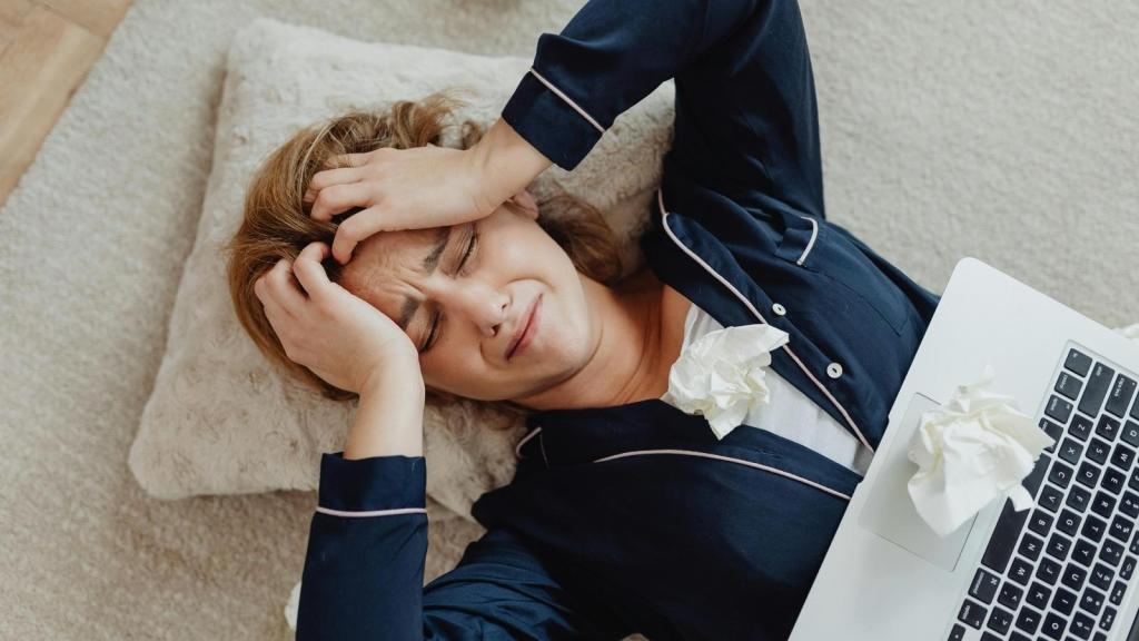upset woman laying on the floor crying