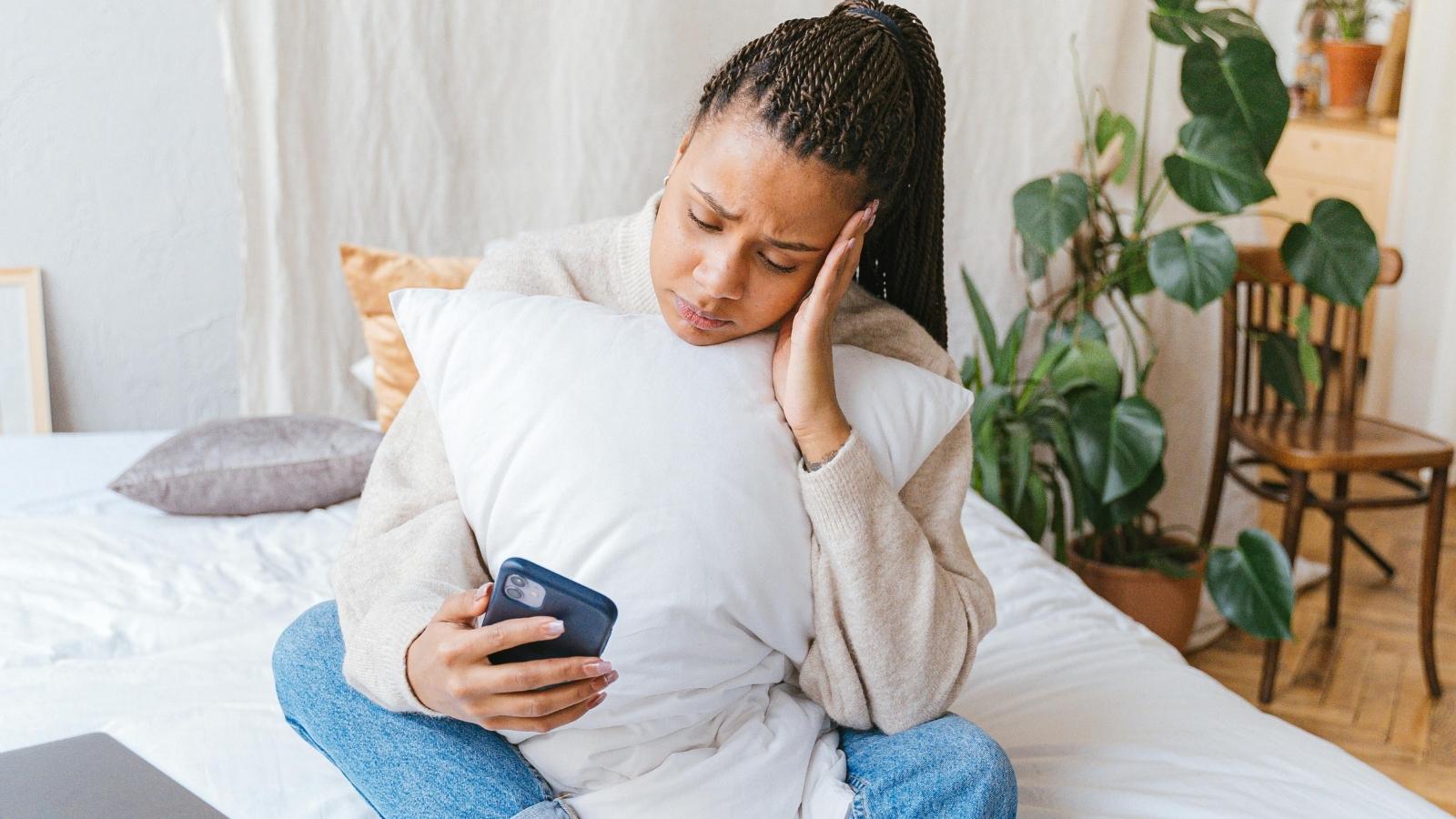 Her Friend No Showed Her Graduation Party Without a Word — Now Shes Considering Skipping the Bridal Shower upset woman looking at her phone