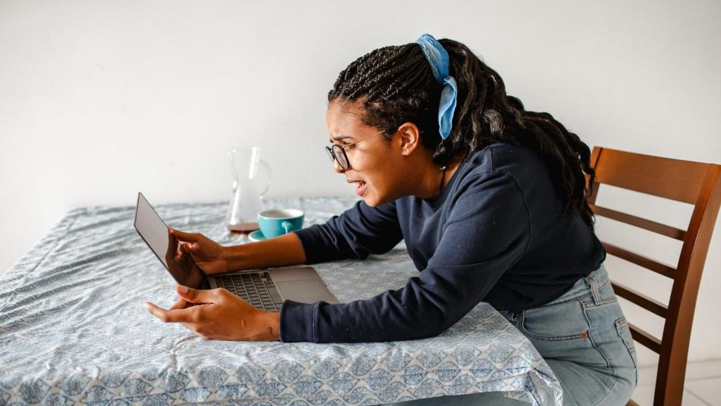 upset woman sitting at her computer