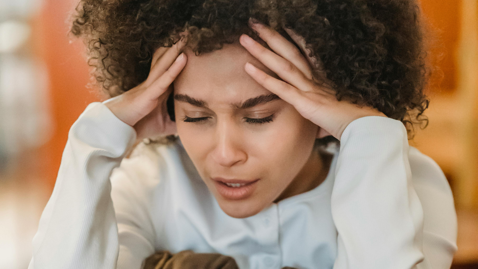 upset woman with hands on her forehead
