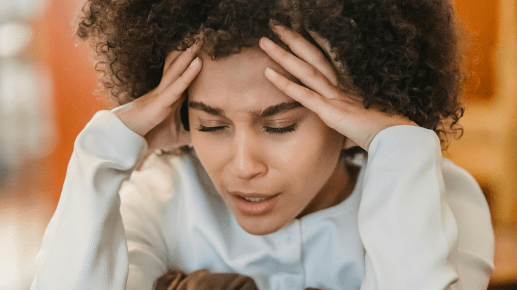 upset woman with hands on her forehead