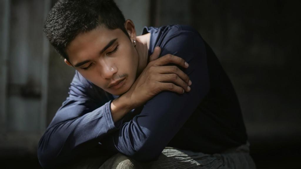 upset young man closing his eyes