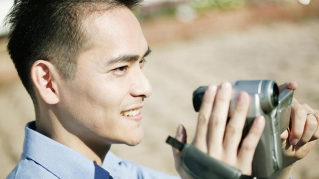 Man with camcorder.