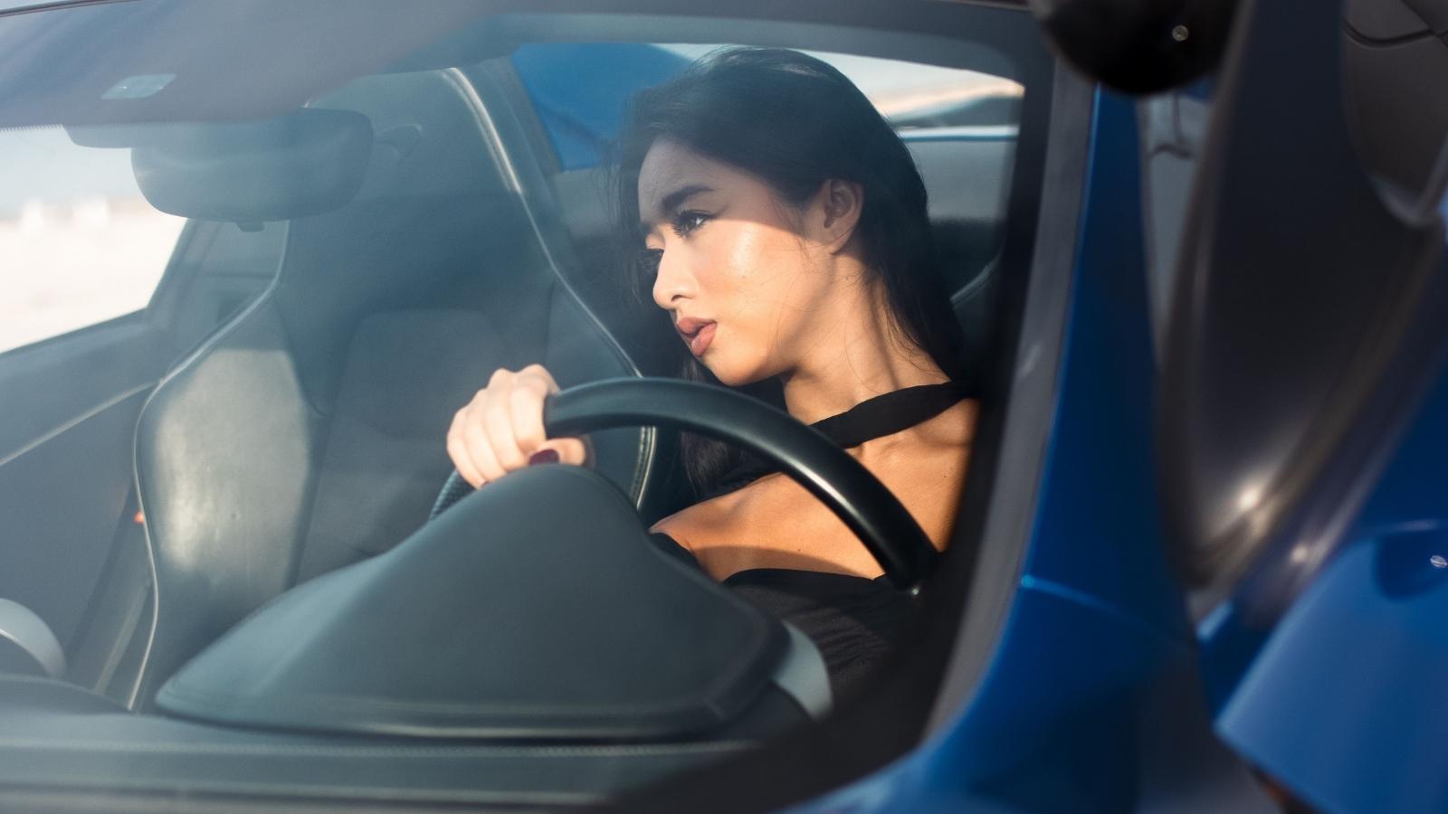 His Girlfriends Sibling Drove His Car Recklessly the Moment She Got Behind the Wheel — Now No One in the Group Can Drive It woman driving a blue sports car