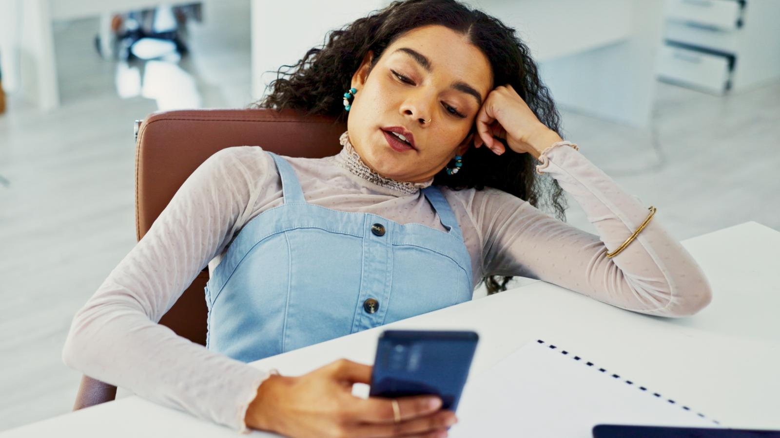 woman looking at her phone