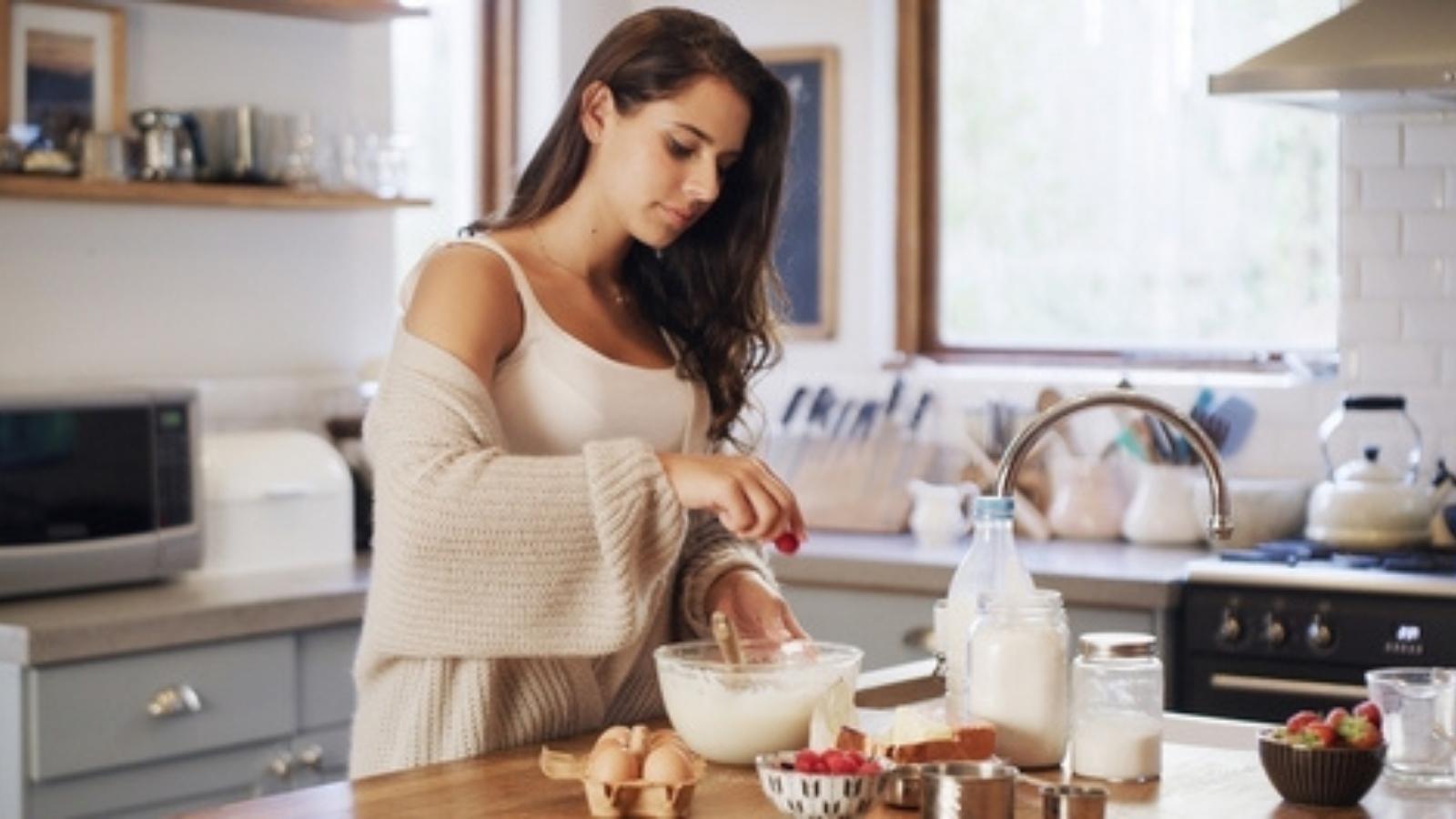 Family Divided After Woman Refuses to Serve Cousin Who Keeps Wasting Her Homemade Desserts Woman baking