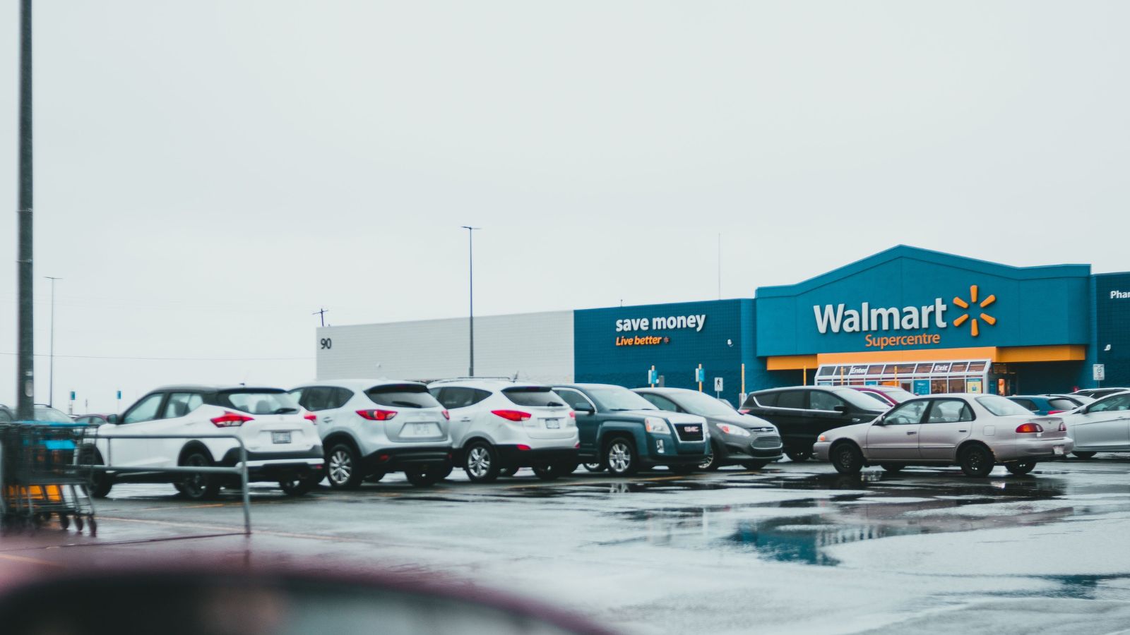 Cars parked at the parking lot of a Walmart store