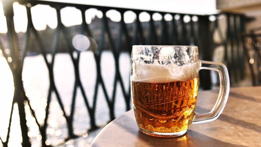 A beer on a table outside