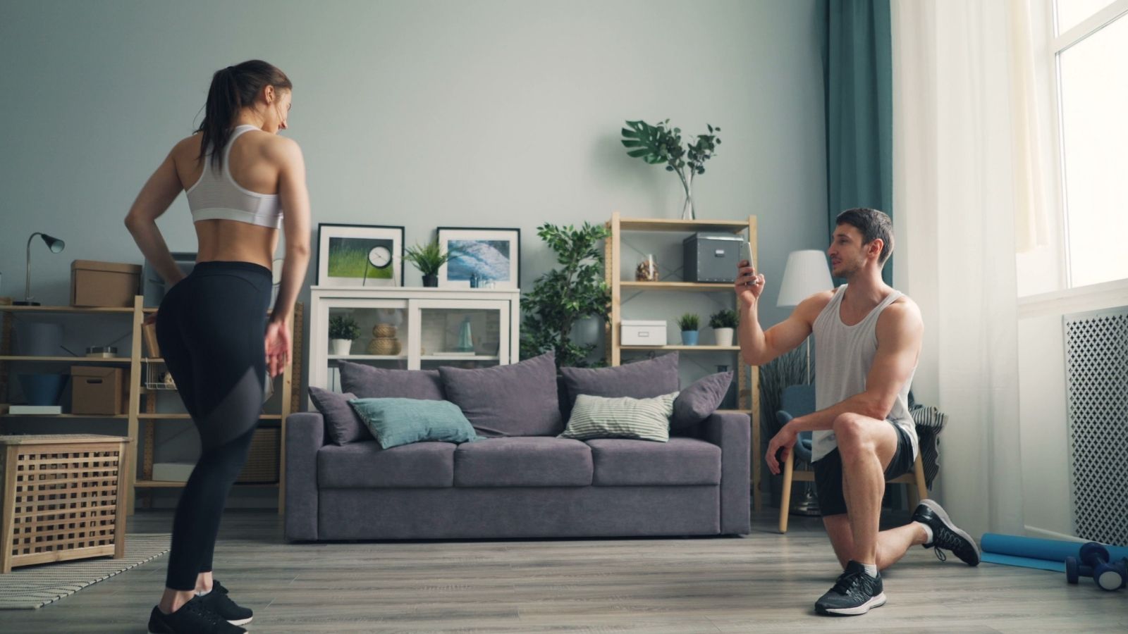 Their Upstairs Neighbors Were Always a Little Strange. But Their Bizarre New Midnight Routine Is Becoming Terrifying. A couple exercising in their living room