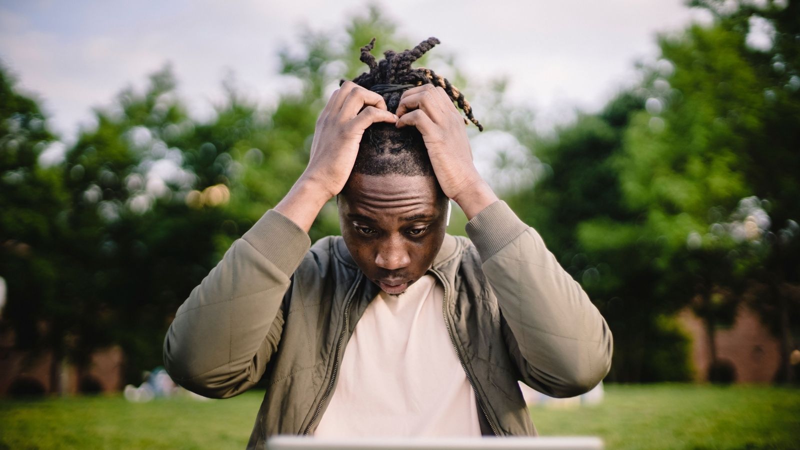 A Researcher Was Excluded From an Overseas Conference Trip, And When They Complained, the University Cancelled Everyones Trip A man with his hands on his head