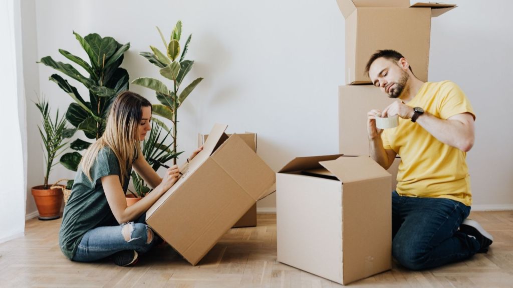 A couple with moving boxes