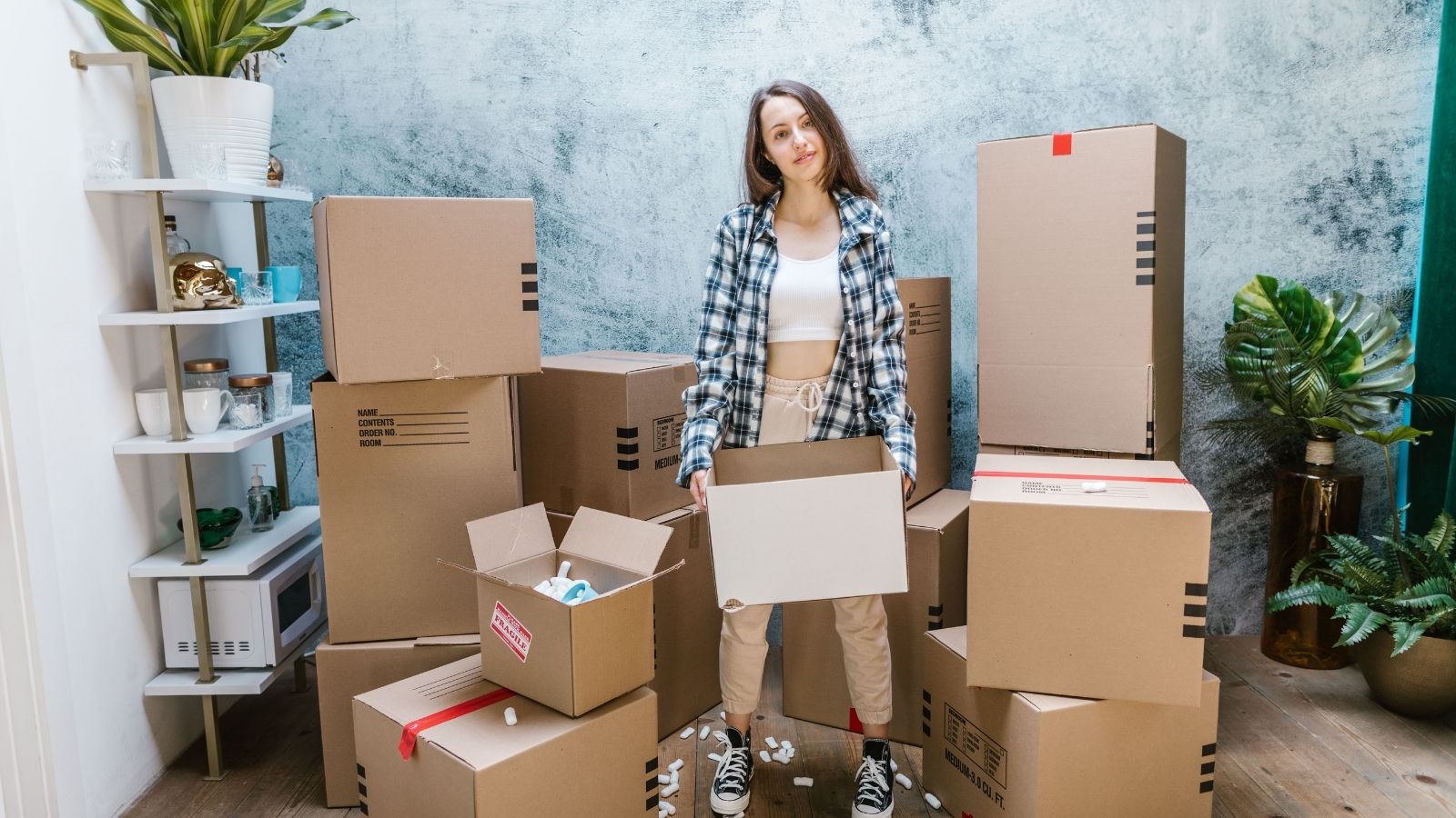 Her Roommate Disappeared and Stopped Paying Rent, but Left the Apartment Packed with Her Belongings. Months Later, the Fallout Is Explosive. A woman filling boxes