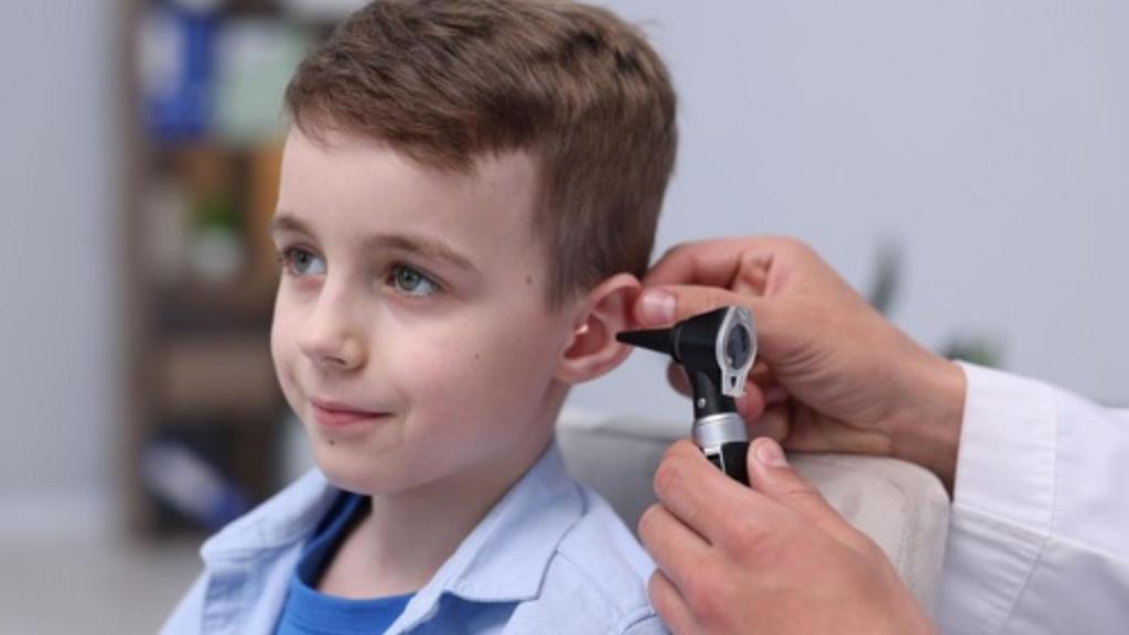 Kid having his ears checked