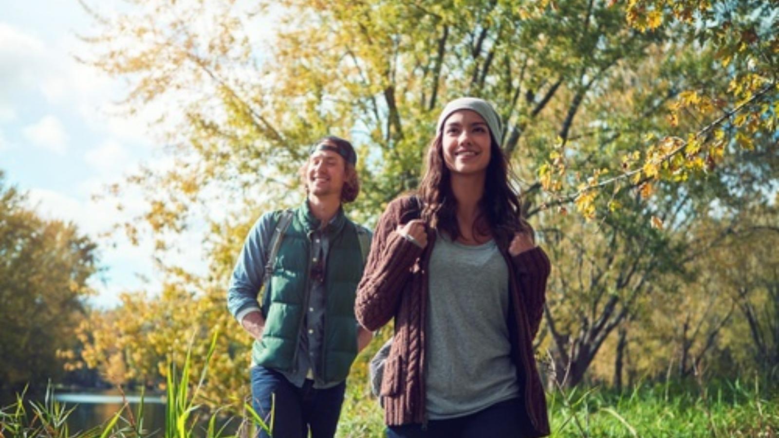She Showed Up for a Group Hike. The Heartbreaking Reason Her Friends Rode Off on Bikes and Left Her in a Dangerous Wilderness. Couple hiking in the woods