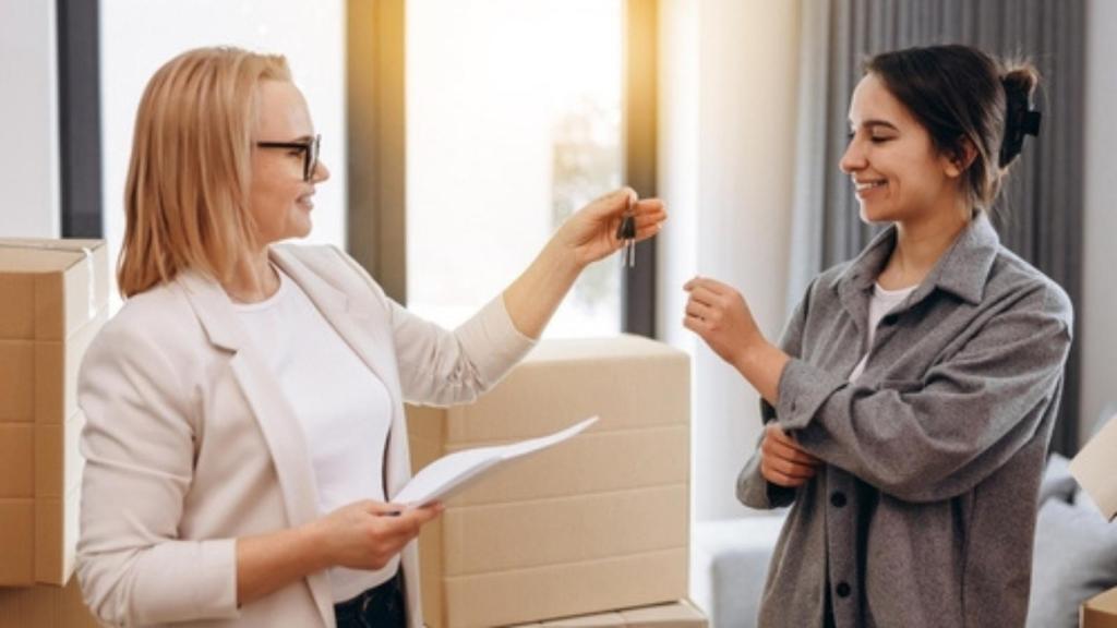 Landlord handing tenant keys