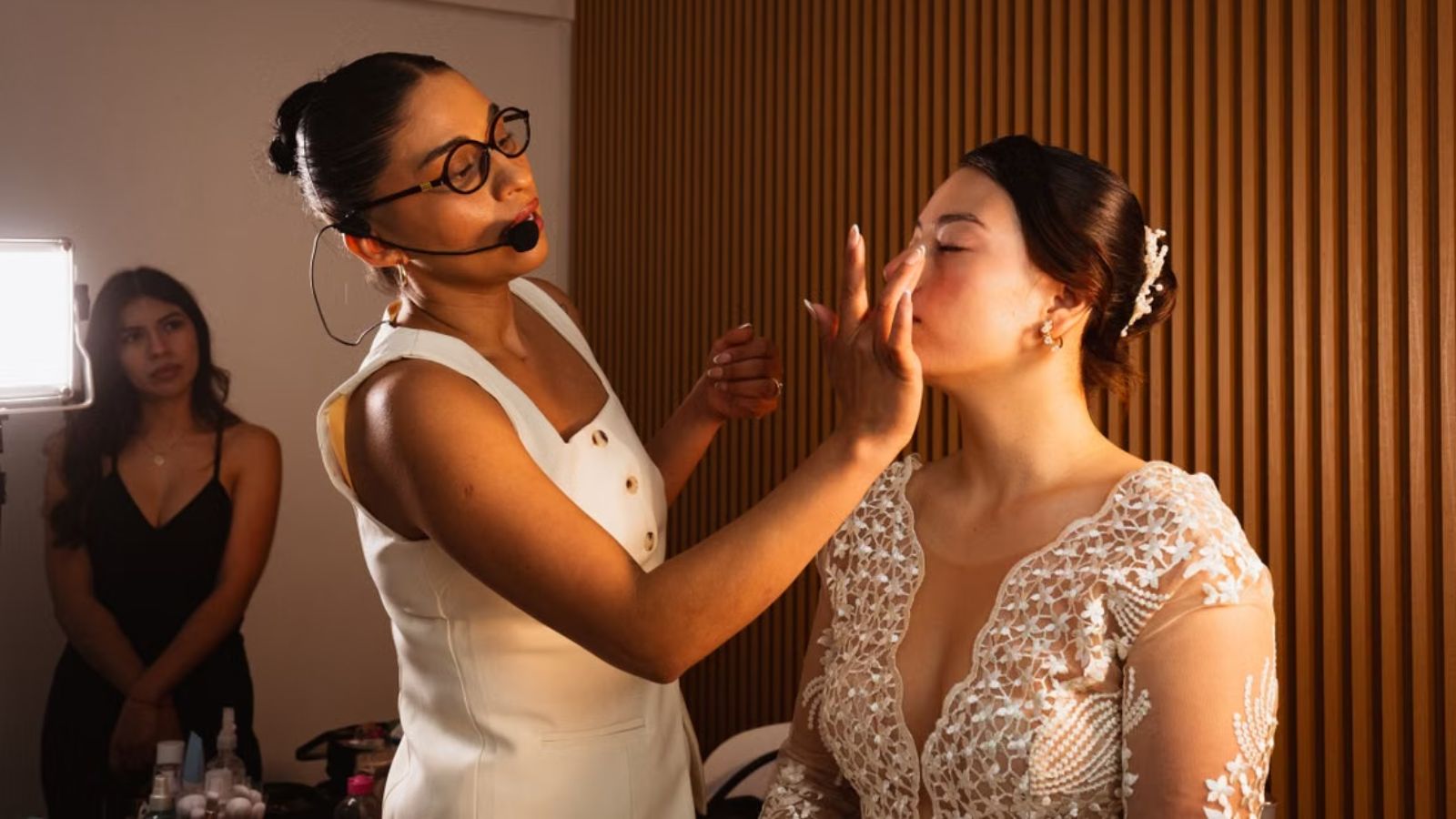 She Trusted Her Childhood Best Friend With Her Wedding—But Was Left Feeling Alone Makeup artist putting makeup on. the beautiful bride