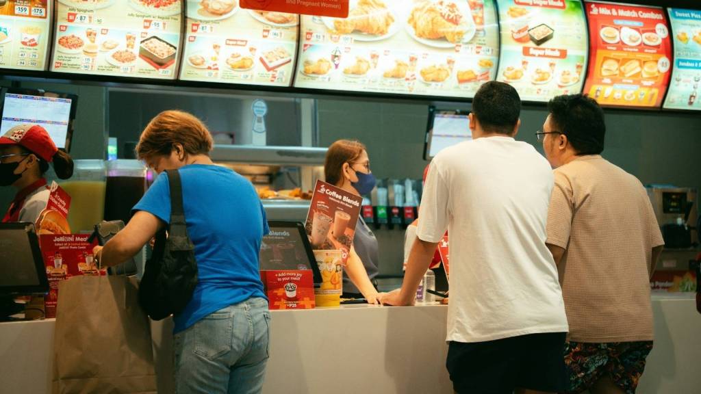 Workers and customers inside a fast food restaurant