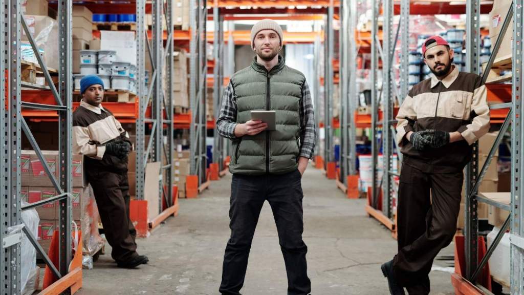 Cashiers standing in the back of a lumber store