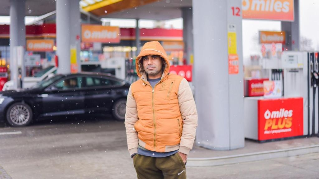 BIL standing outside of a convenience store