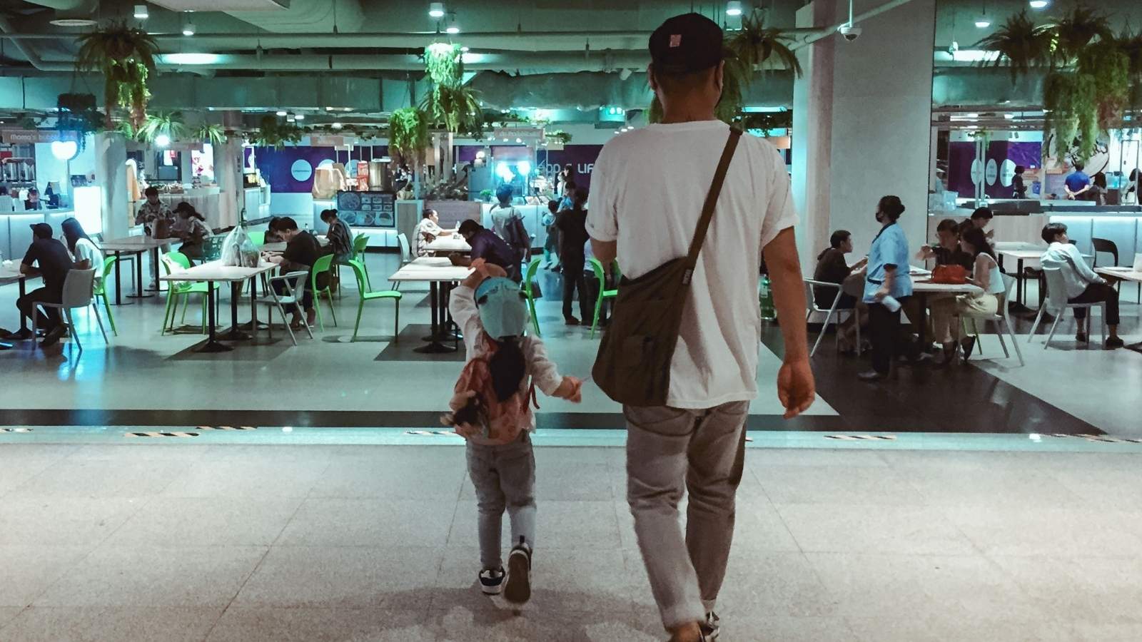 A Cashier Ignored His Friendly Greeting. On His Next Visit, He Gave Her a Taste of Her Own Medicine. Man and his daughter walking toward the food court