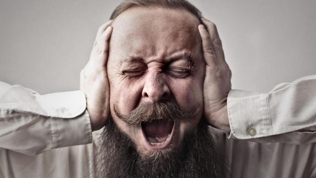 Man covering his ears
