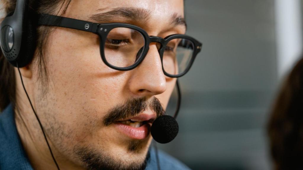 Man working tech support with a headset on