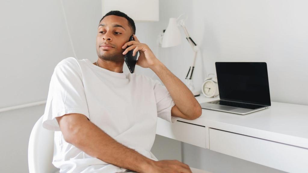 Man on the phone to his internet service provider