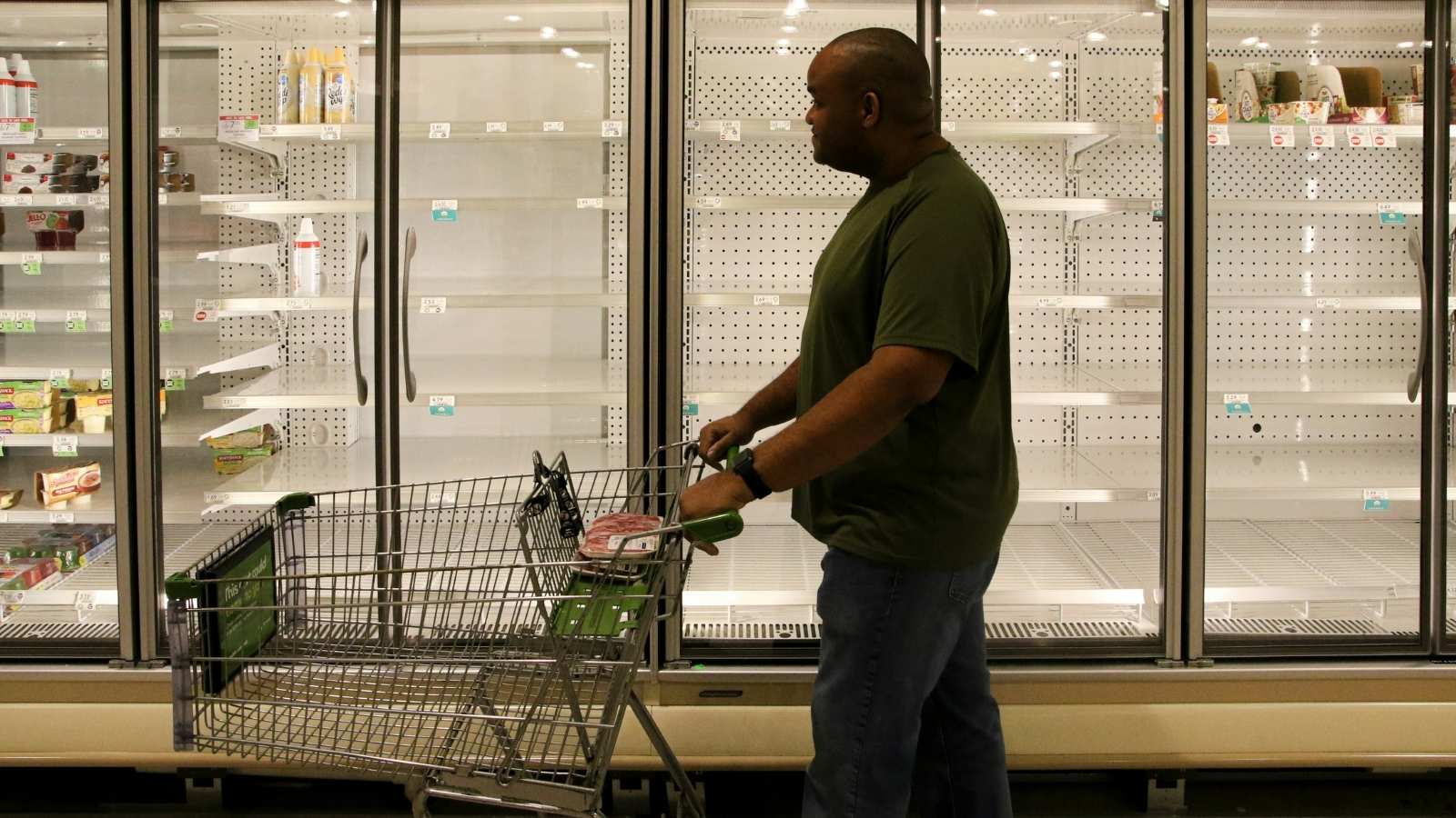 He Tried to Buy One Roll of Tape — The Store Said He Needed a Cart — So He Grabbed Two and Got Banned Man pushing cart through store
