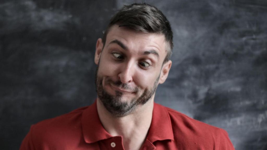 Man acting goofy because he encountered dumb people at the store