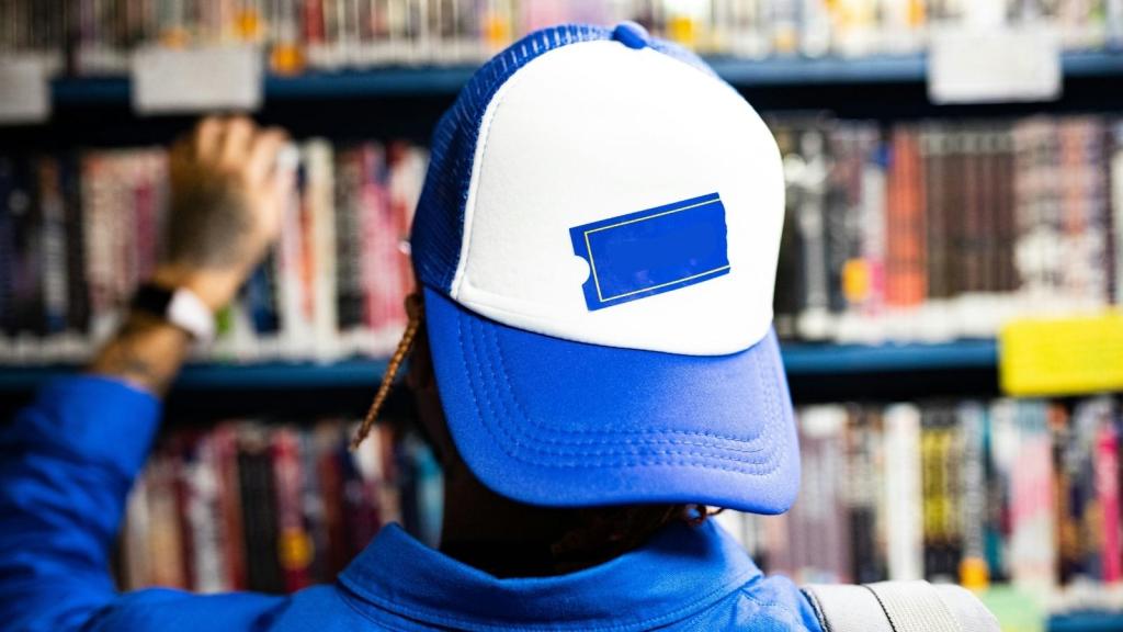 Man wearing a movie store hat