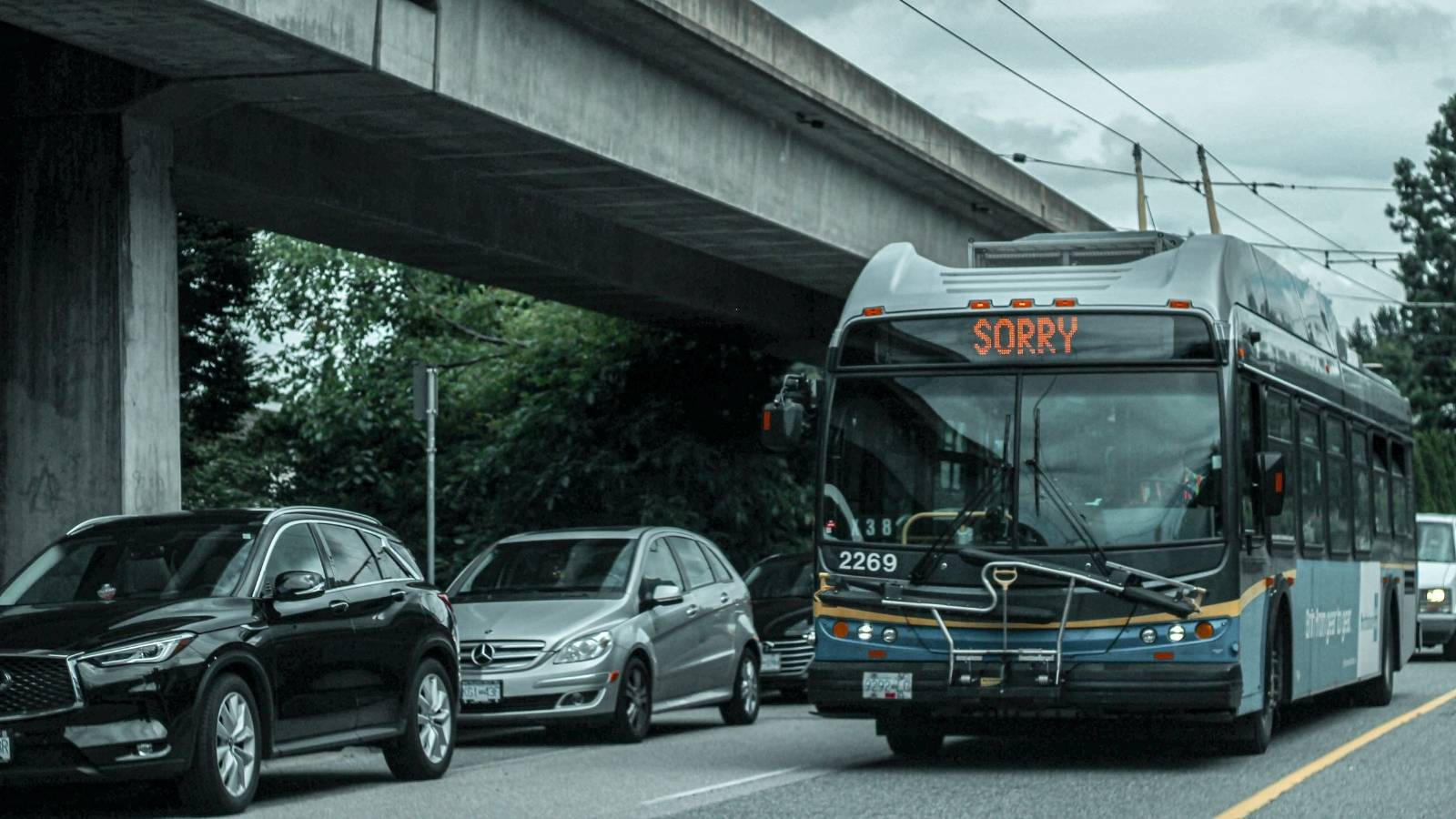 Bus driving down a busy city street