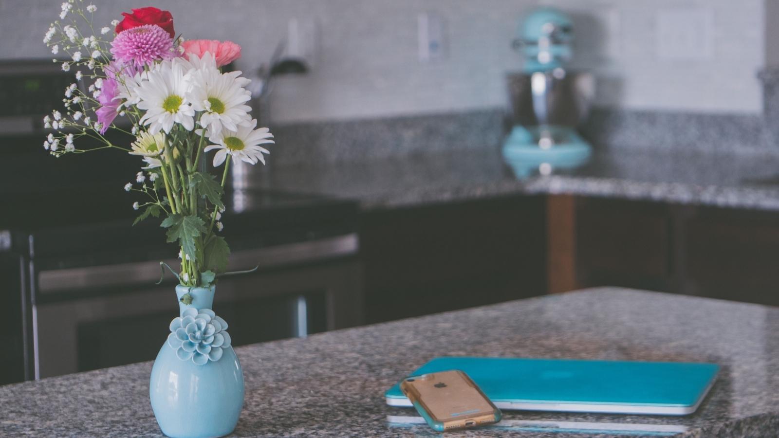 Fresh flowers in a vase on the kitchen counter